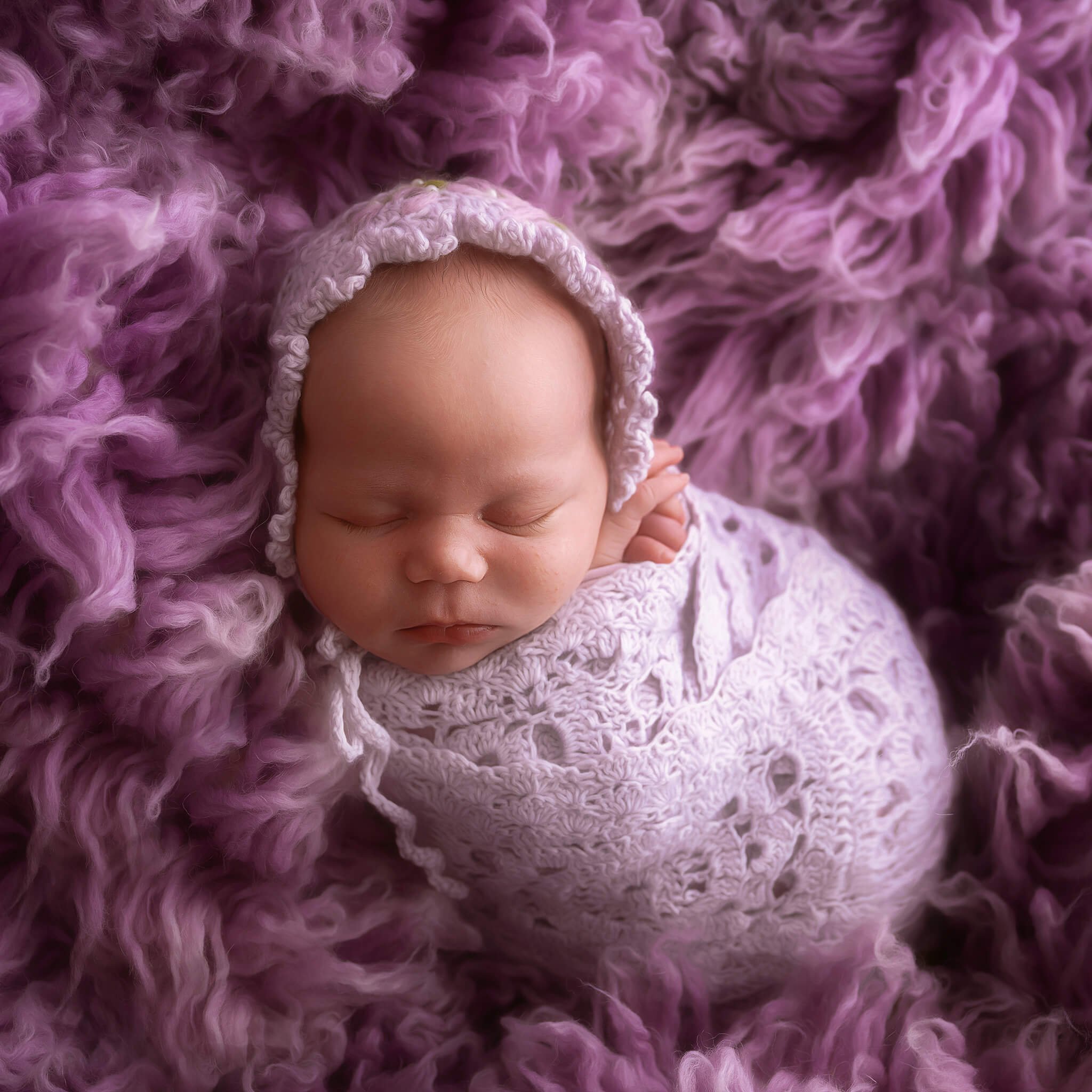 Newborn in crochet bonnet and wrap set.jpg