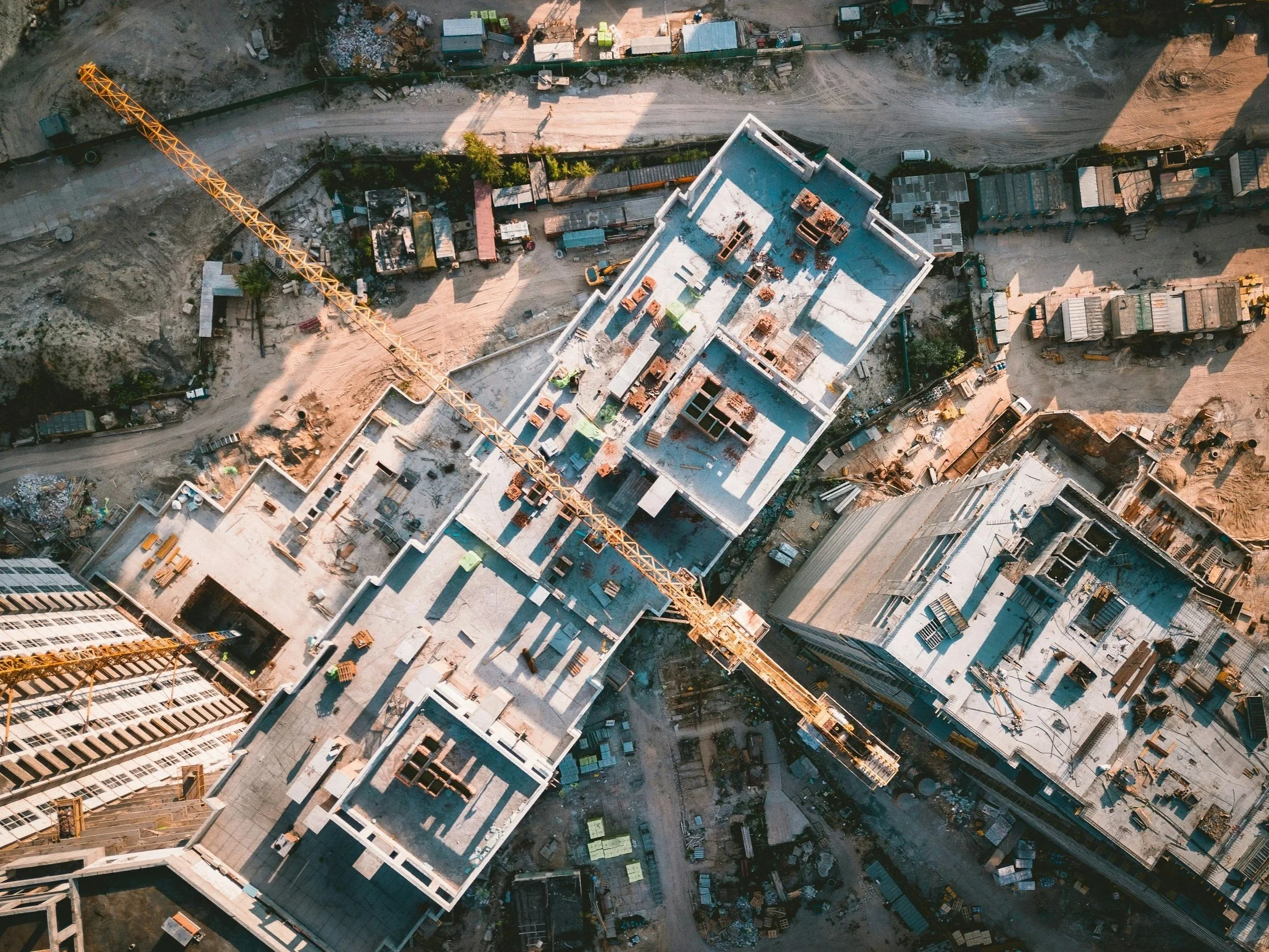 aerial image of construction site with crane