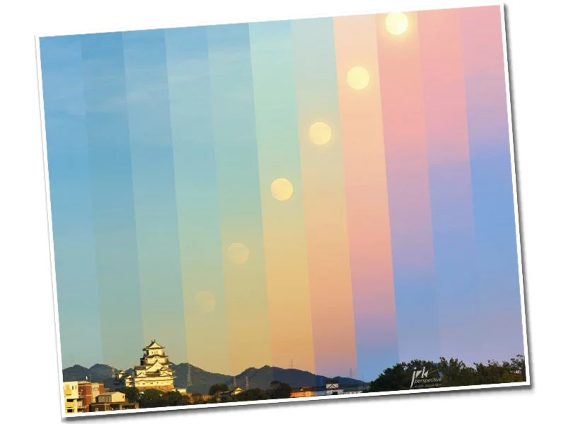 Colorful aerial view of a cityscape with a traditional Japanese castle in the foreground, overlaid with a rainbow spectrum and sun or moon spots.