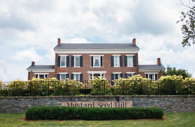 Airbnb exterior property view with testimonial about increased revenue and property performance after working with Host and Stay