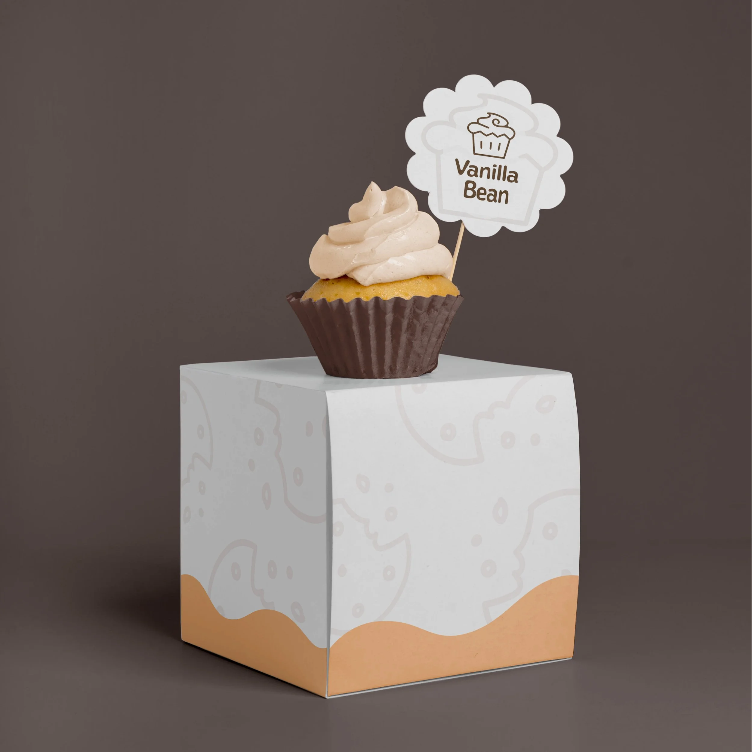 A minimalistic box design that leaves space for branded labels and write-on details about what is inside. A sample display case card for events reads "vanilla bean". 