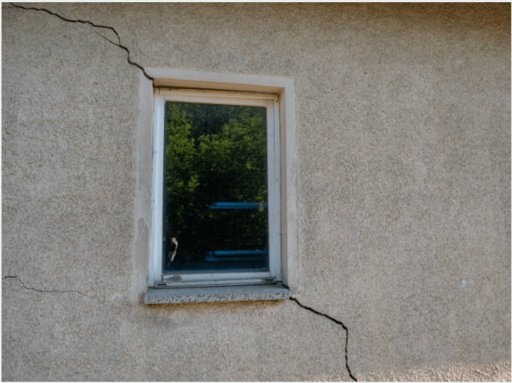 an exterior wall with a diagonal crack