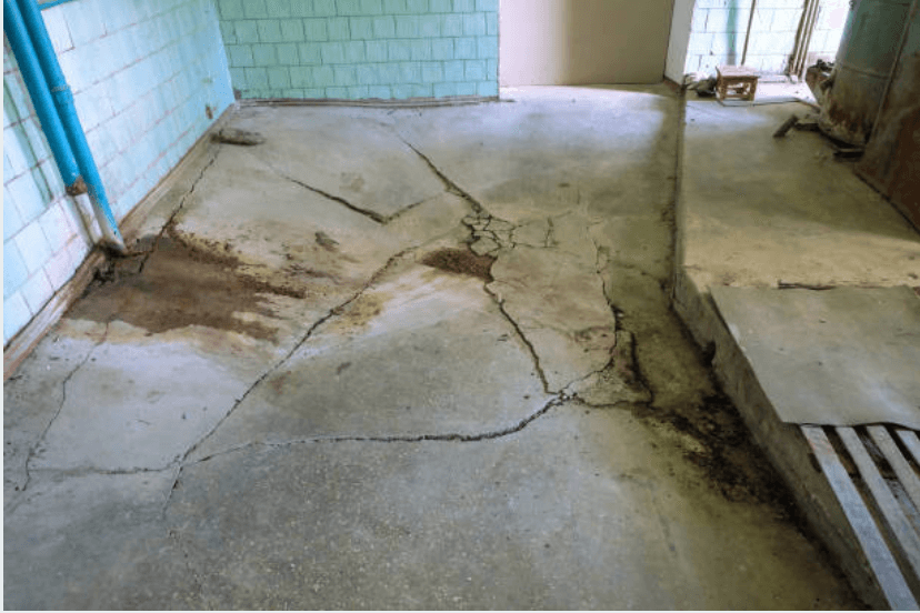 a sinking and uneven concrete floor
