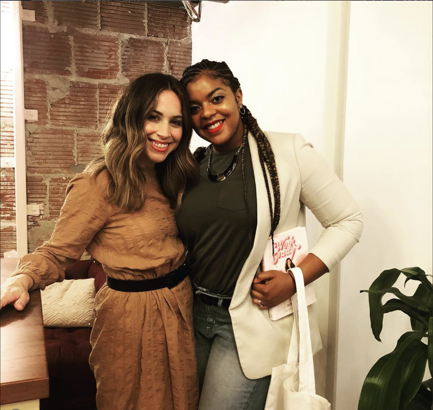 Jaclyn Johnson and I posing after getting my personal copy of Work Party book