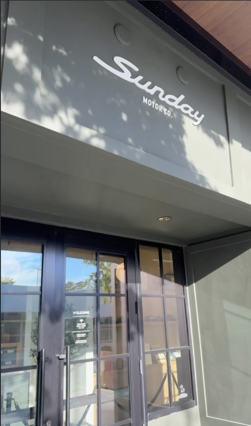 Sunday Motor Co - in west palm beach store front in the morning.