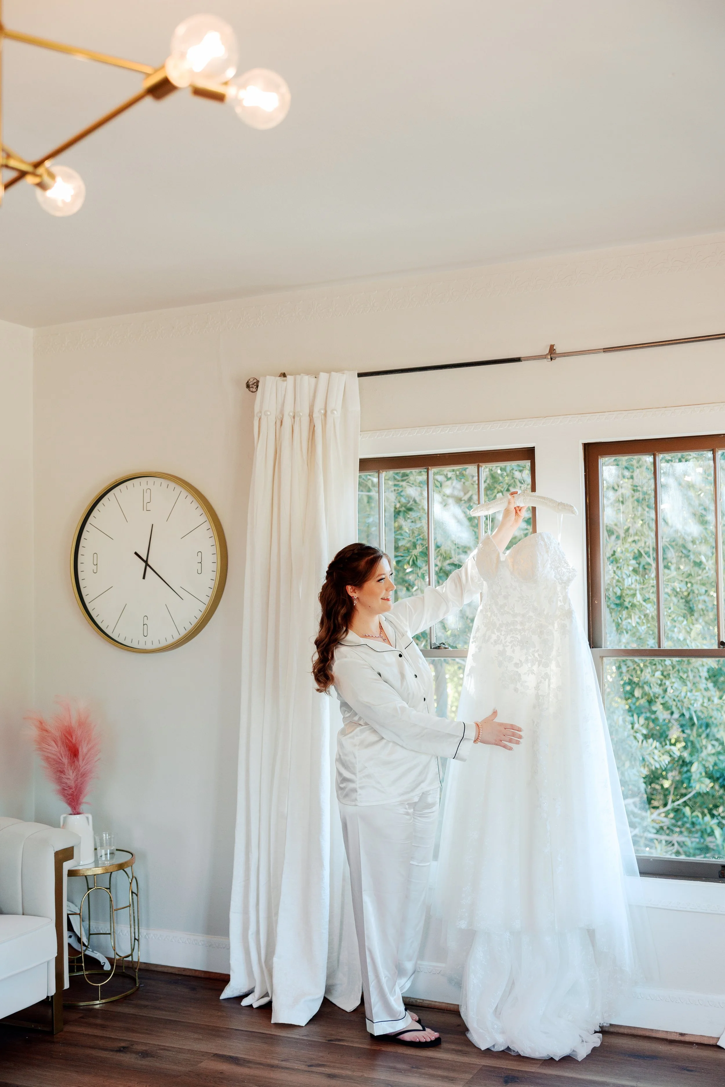 Bride fluffing her dress smiling and excited for her wedding day