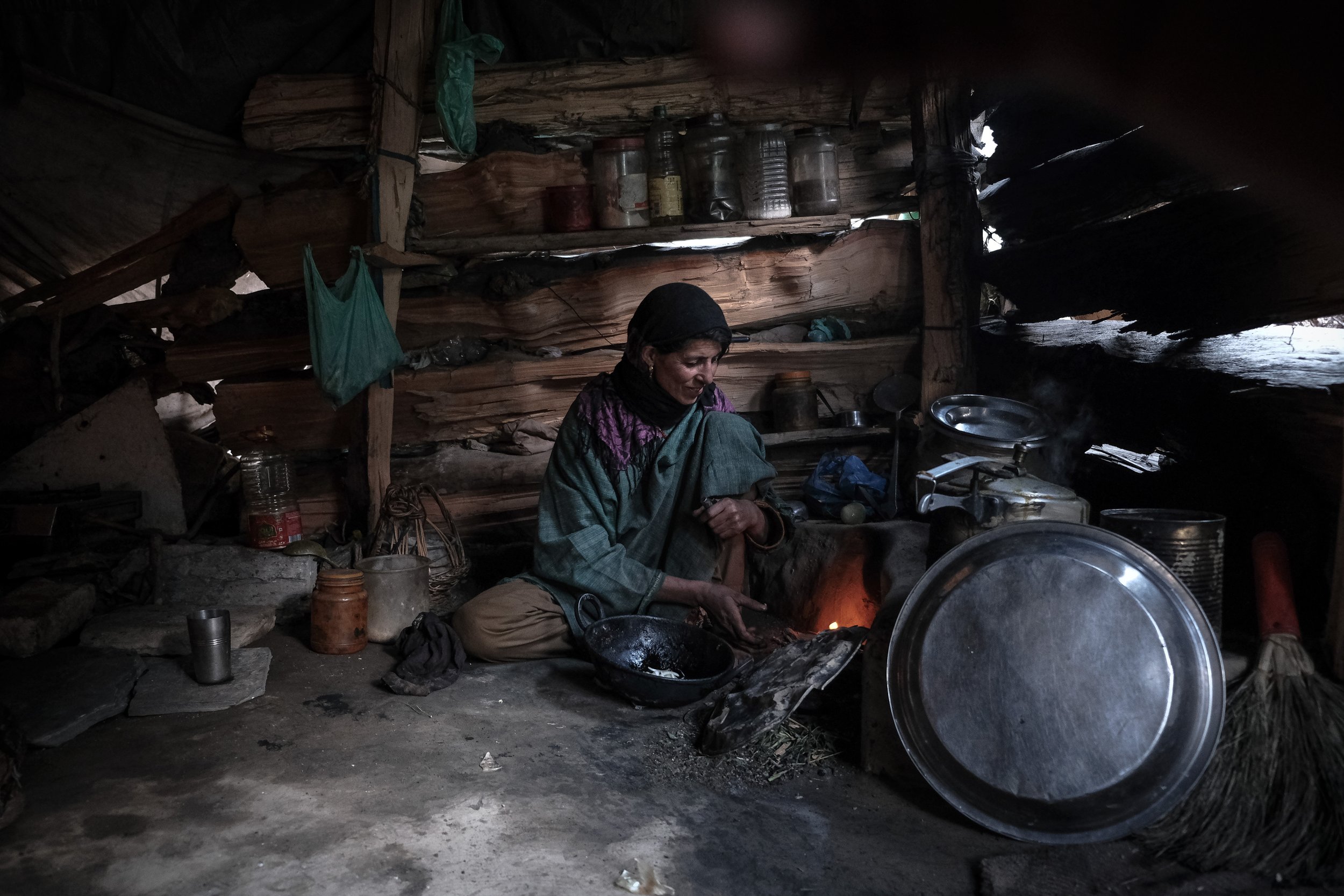 A Chopan woman prepares tea in her temporary Kotha (shelter) in Zoji La, a high mountain pass of the Himalayas