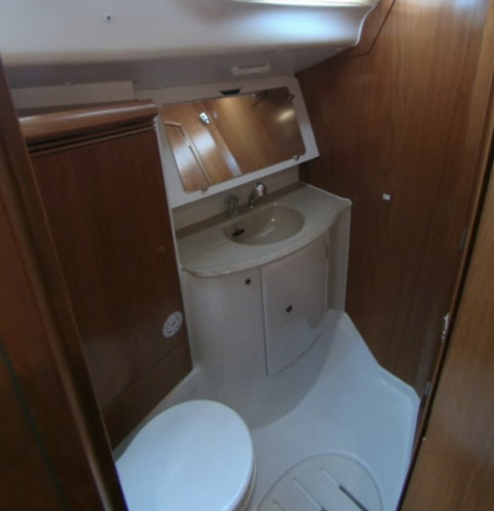 Compact yacht bathroom with sink and mirror