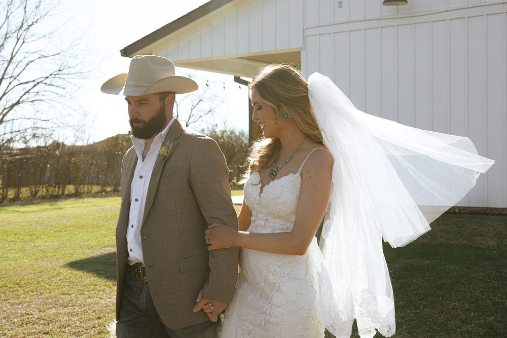 western wedding bride and groom at a barn wedding venue