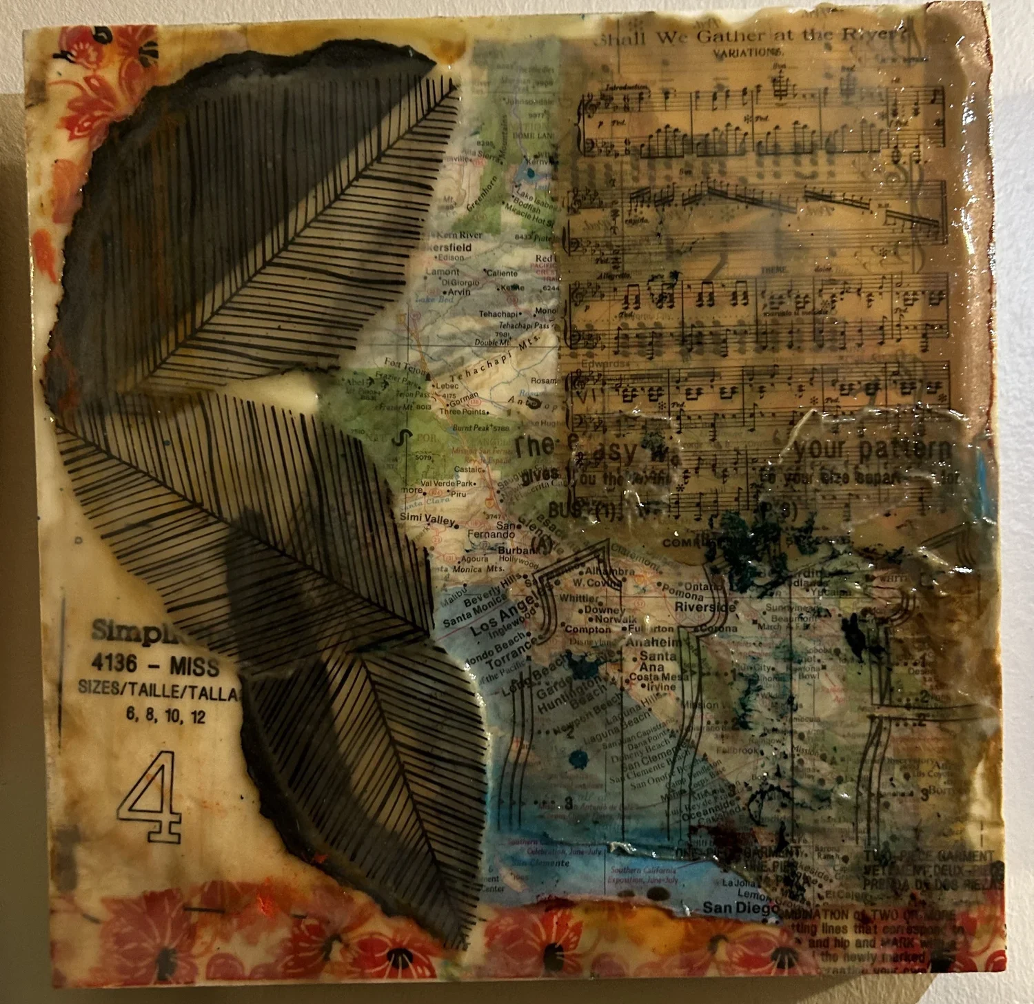 Roots, encaustic mixed media collage with antique sheet music and a map of Los Angeles