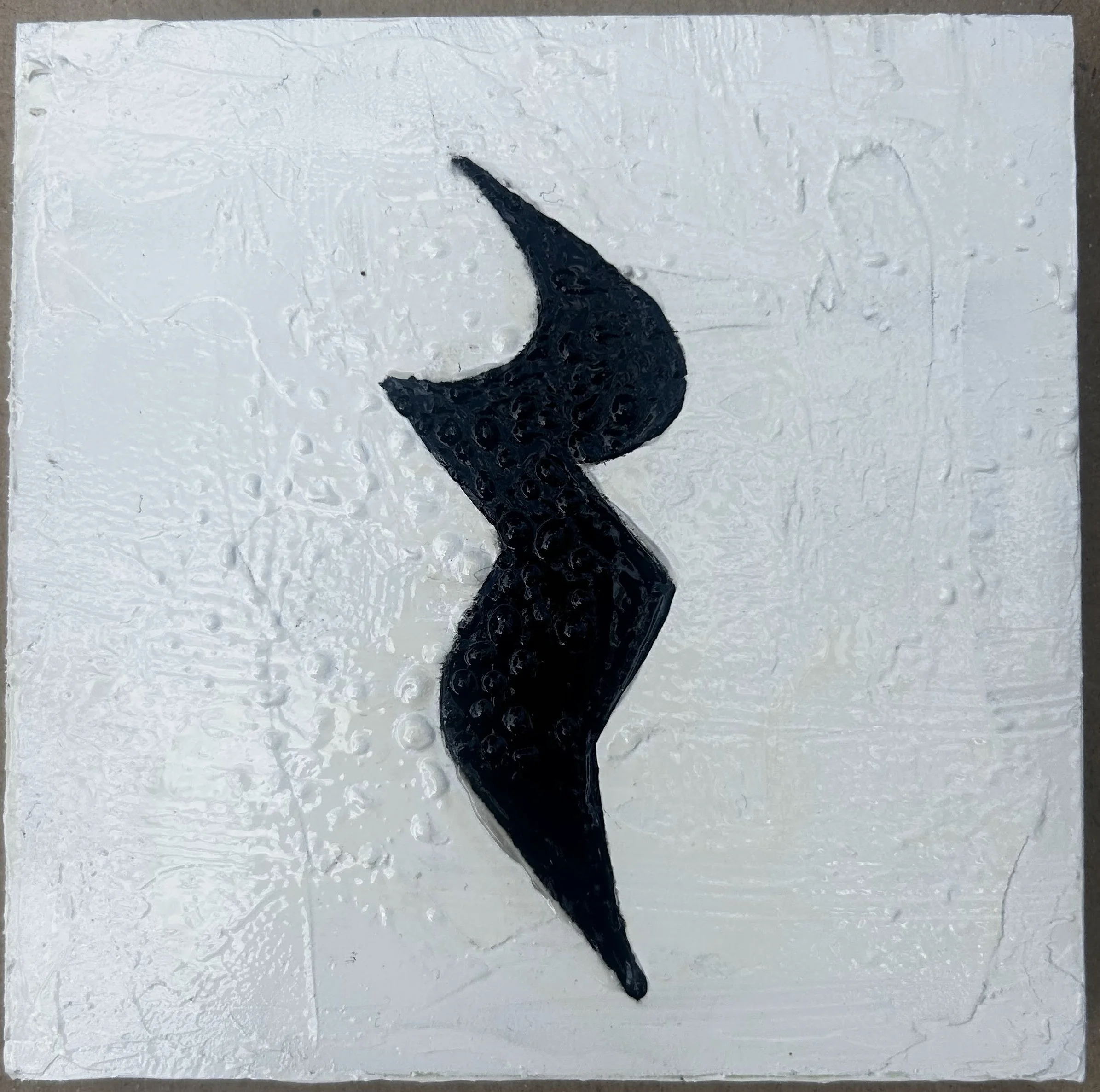 Black abstract wave shape on a white textured background