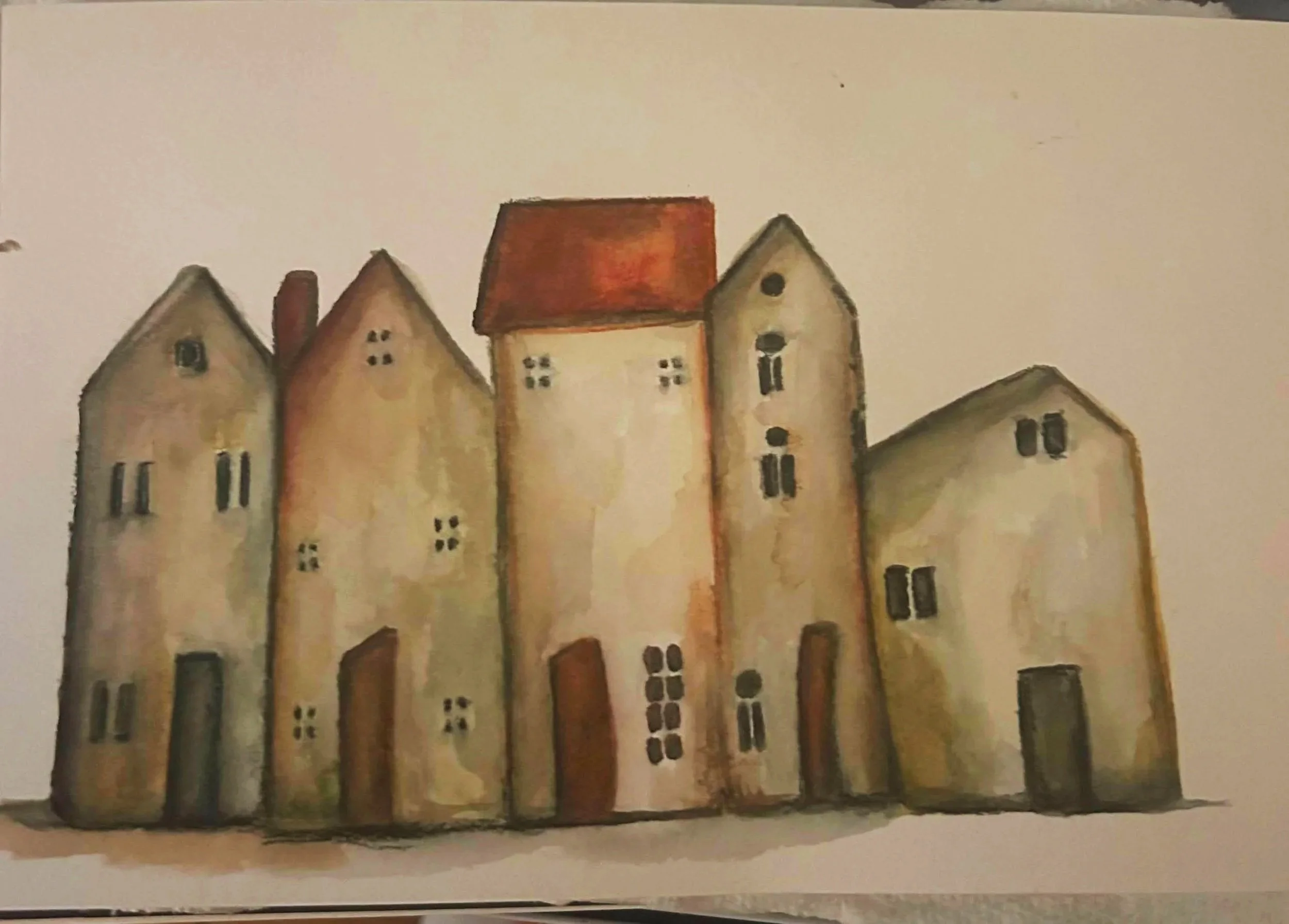 Watercolor painting of a row of tall, narrow village houses with red roofs