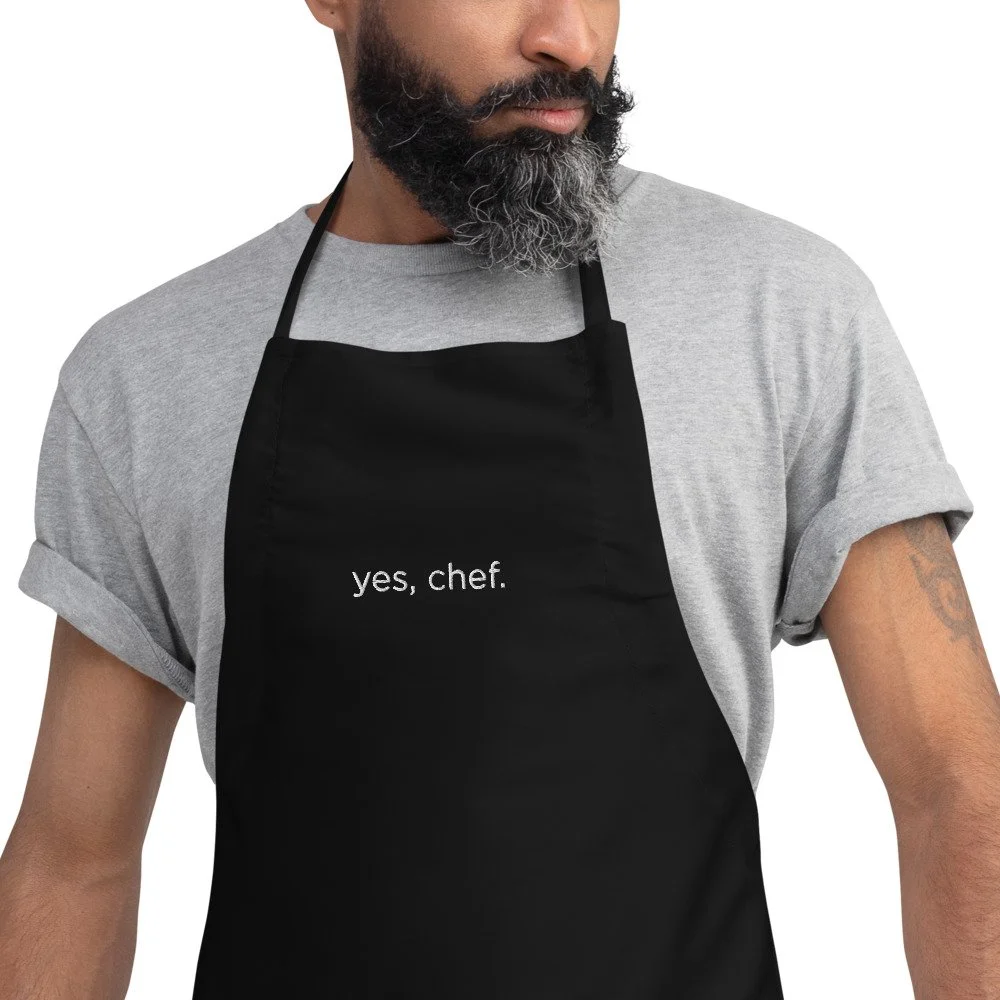 embroidered-apron-black-zoomed-in-692cfad11870e.jpg