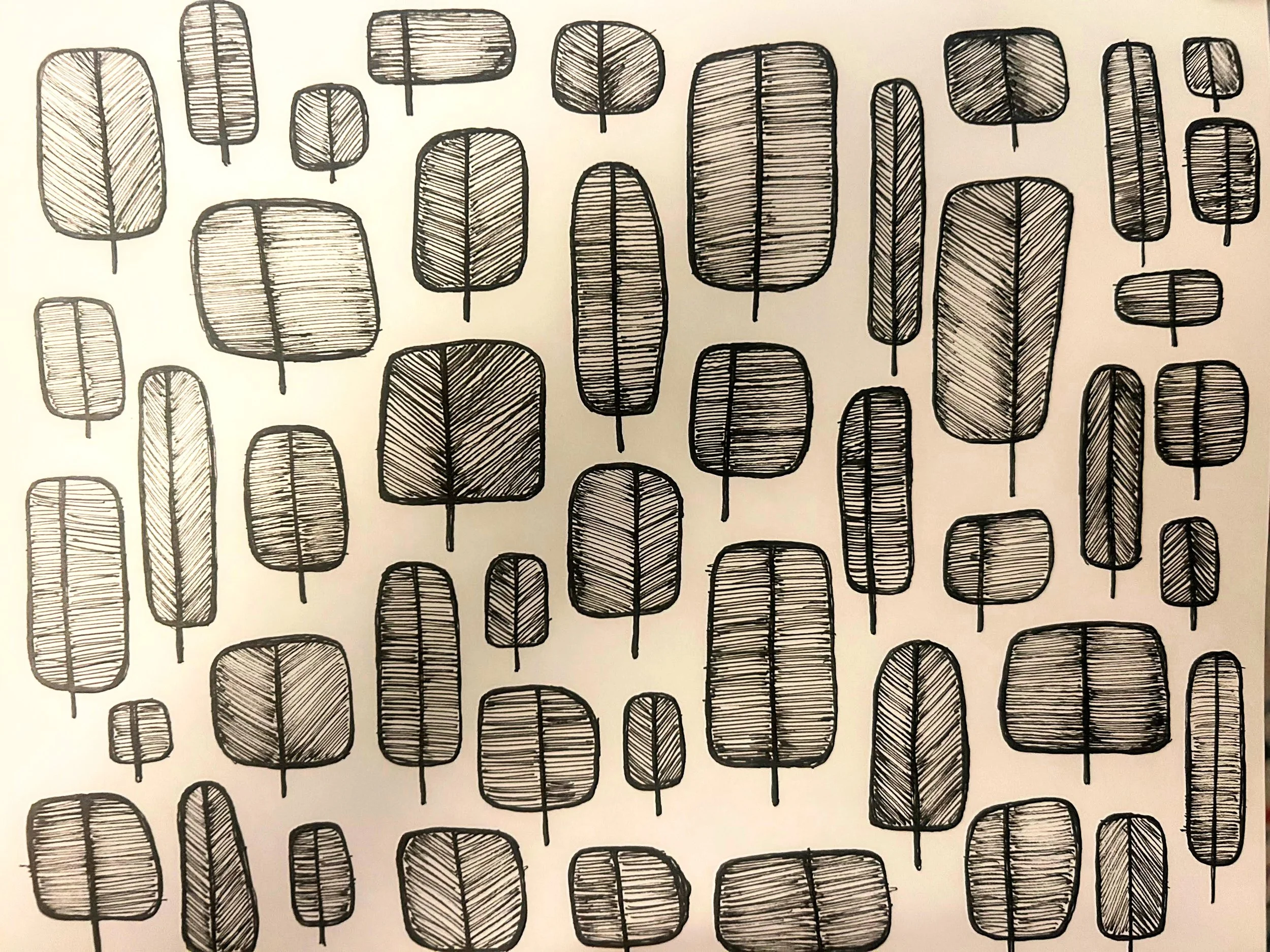 Ink drawing pattern of stylized trees and leaves in varied shapes