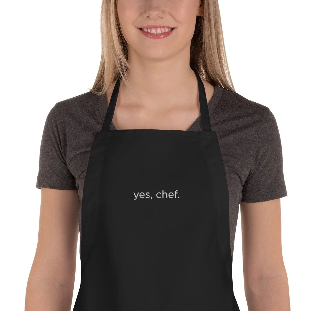 embroidered-apron-black-zoomed-in-692cfad117c5a.jpg