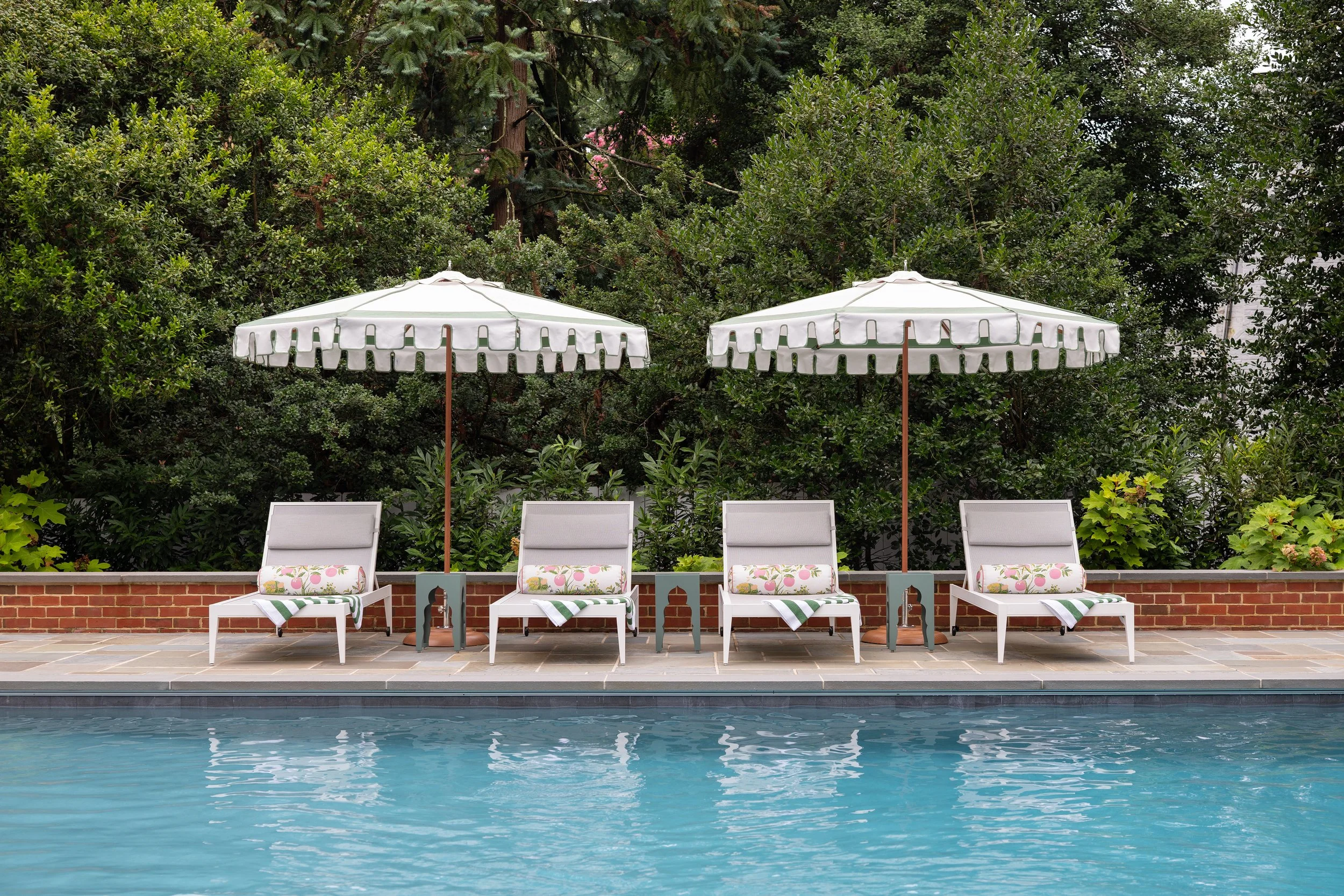 Beautiful pool with chaises and resort style umbrellas