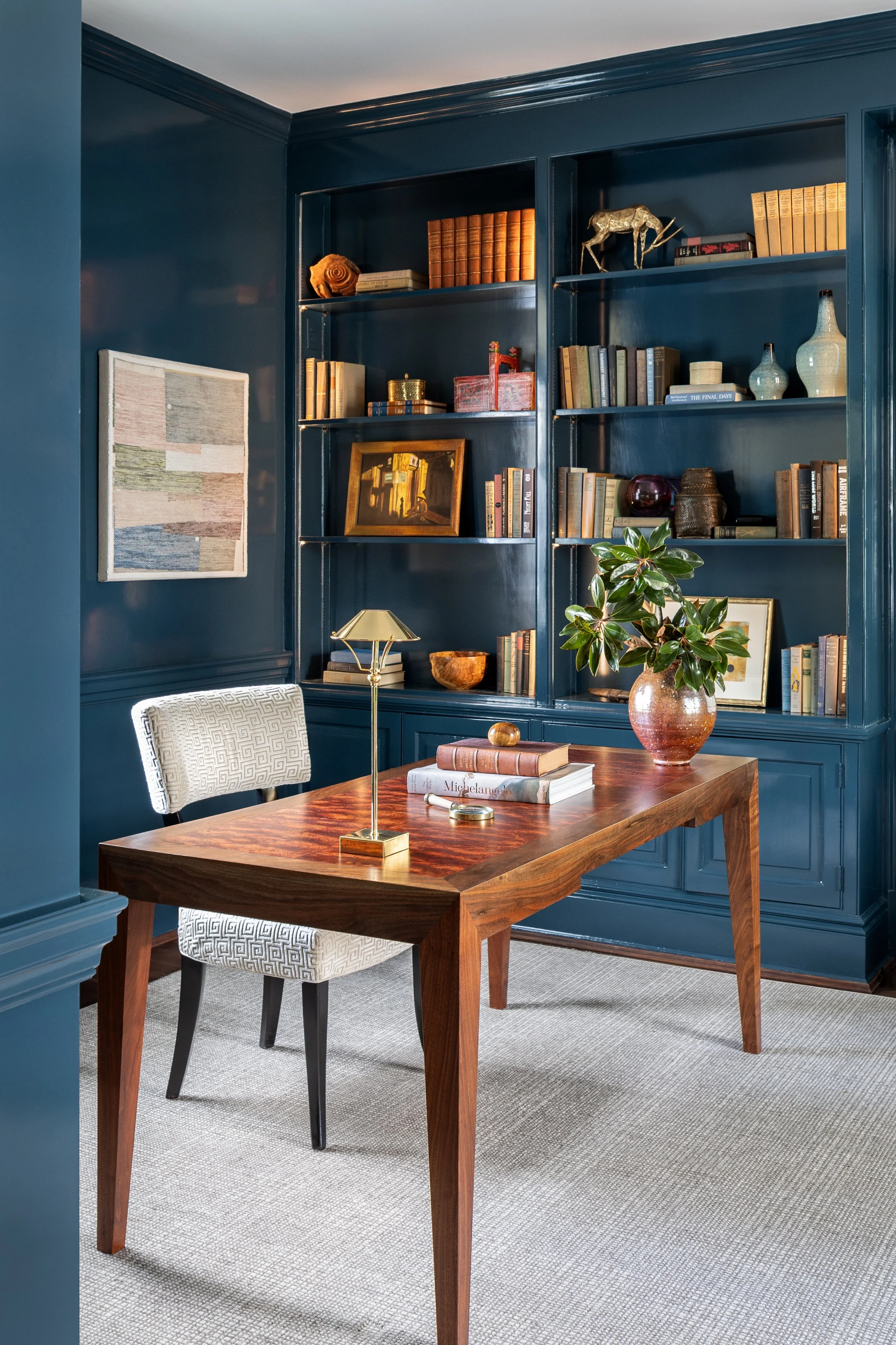Home office featuring custom cabinetry, custom desk,  originial art, and timeless traditional design.