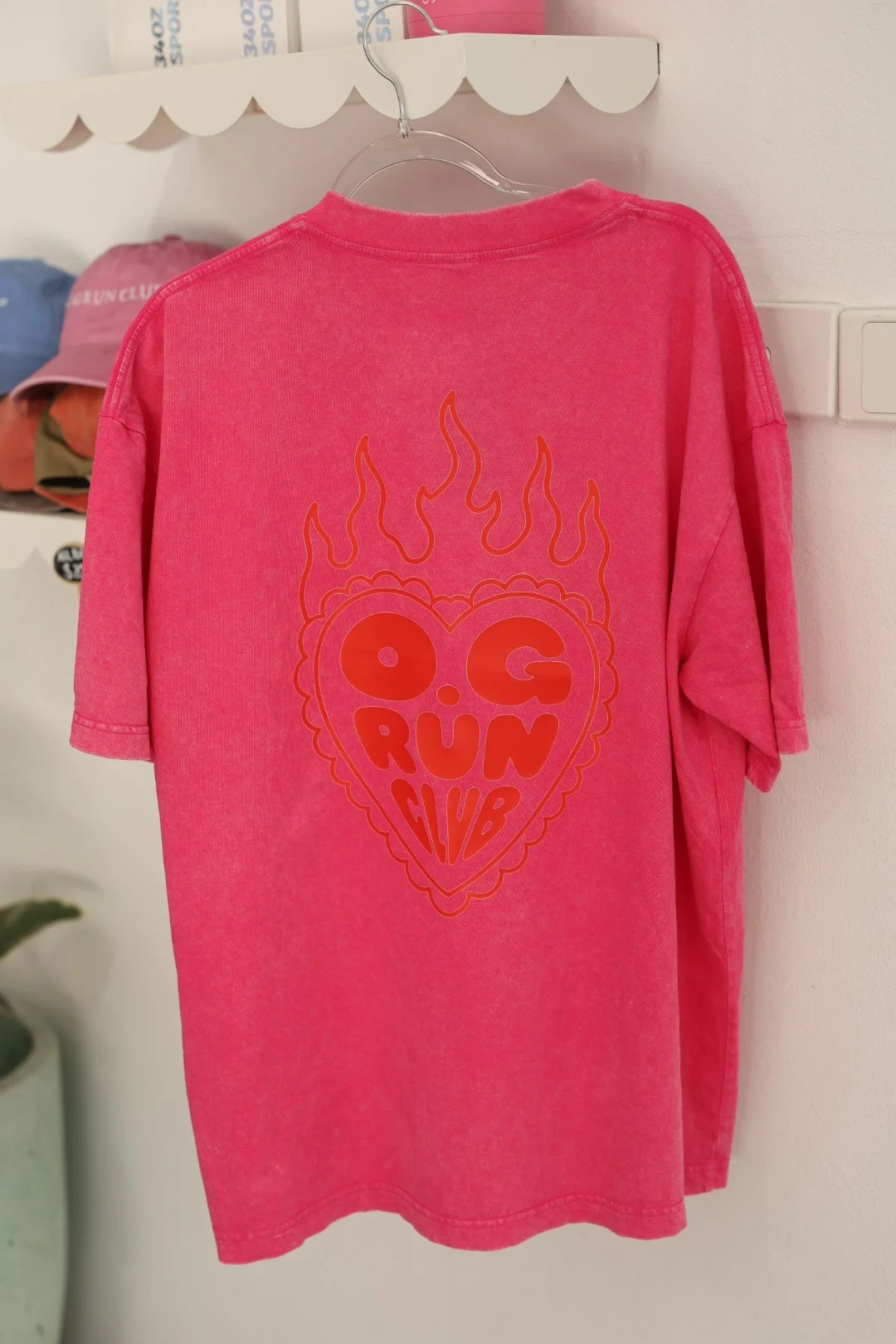 Back of the pink O.G Run Club oversized washed tee