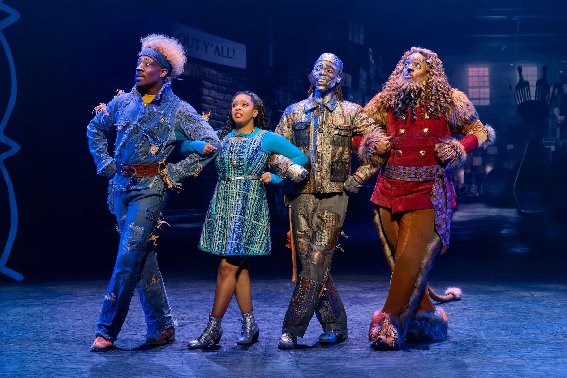 L-R: Eliah Ahmad Lewis as the Scarecrow, Dana Cimone as Dorothy, D. Jerome as the Tinman, and Cal Mitchell as the Lion in The Wiz
