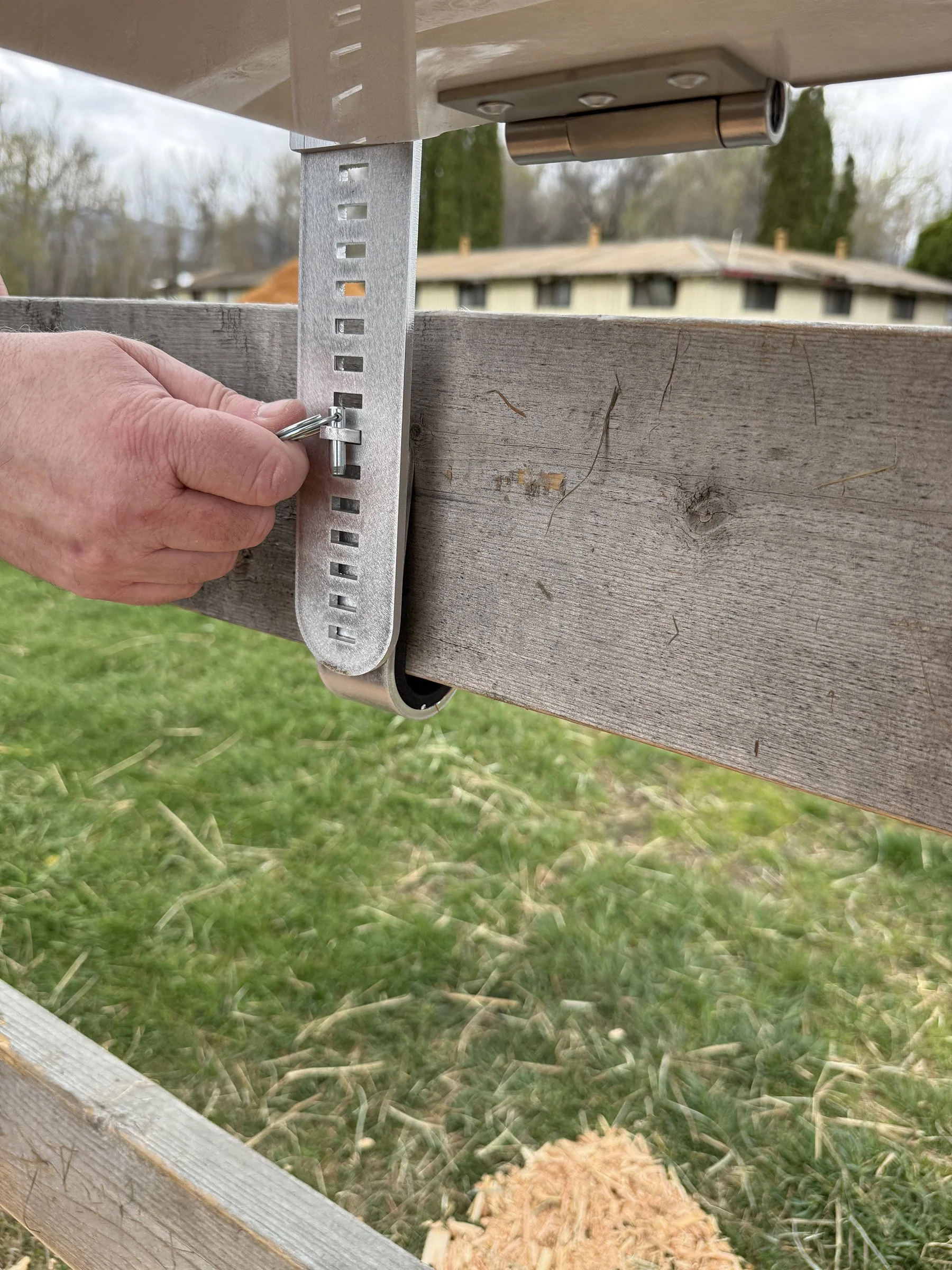 HayBox-battery-powered-auto-feeder-by-HayPal-installing-lower-hook.jpg