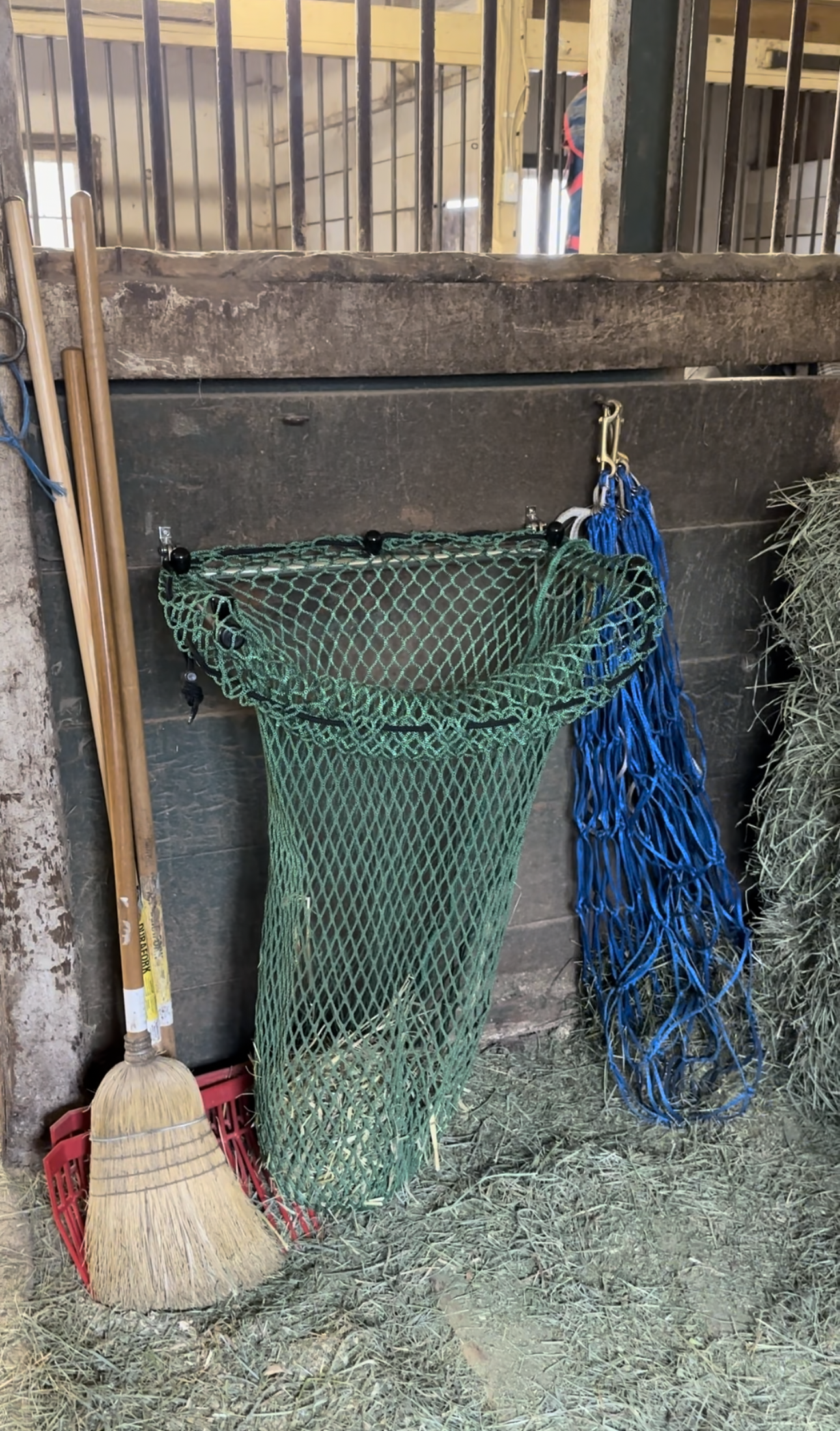 HayPal-mounted-hay-net-filler-in-use.png