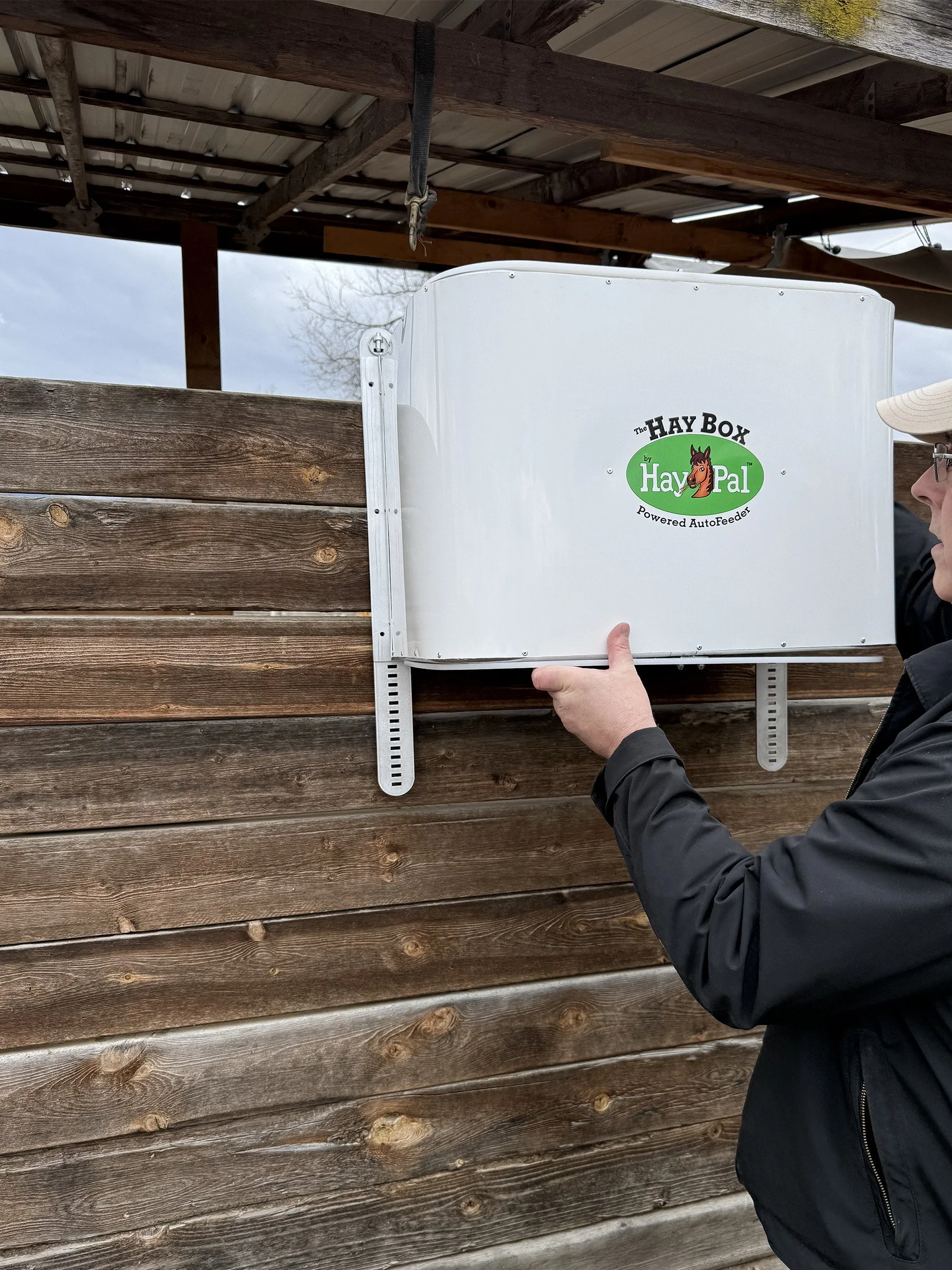 HayBox-battery-powered-auto-feeder-by-HayPal-installing-the-autofeeder.jpg