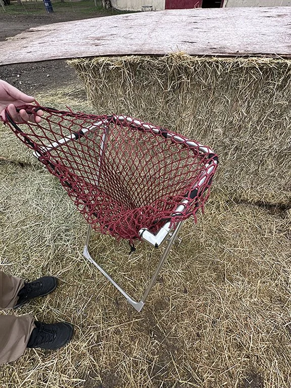 HayPal-hay-net-filler-loading-a-net.jpg
