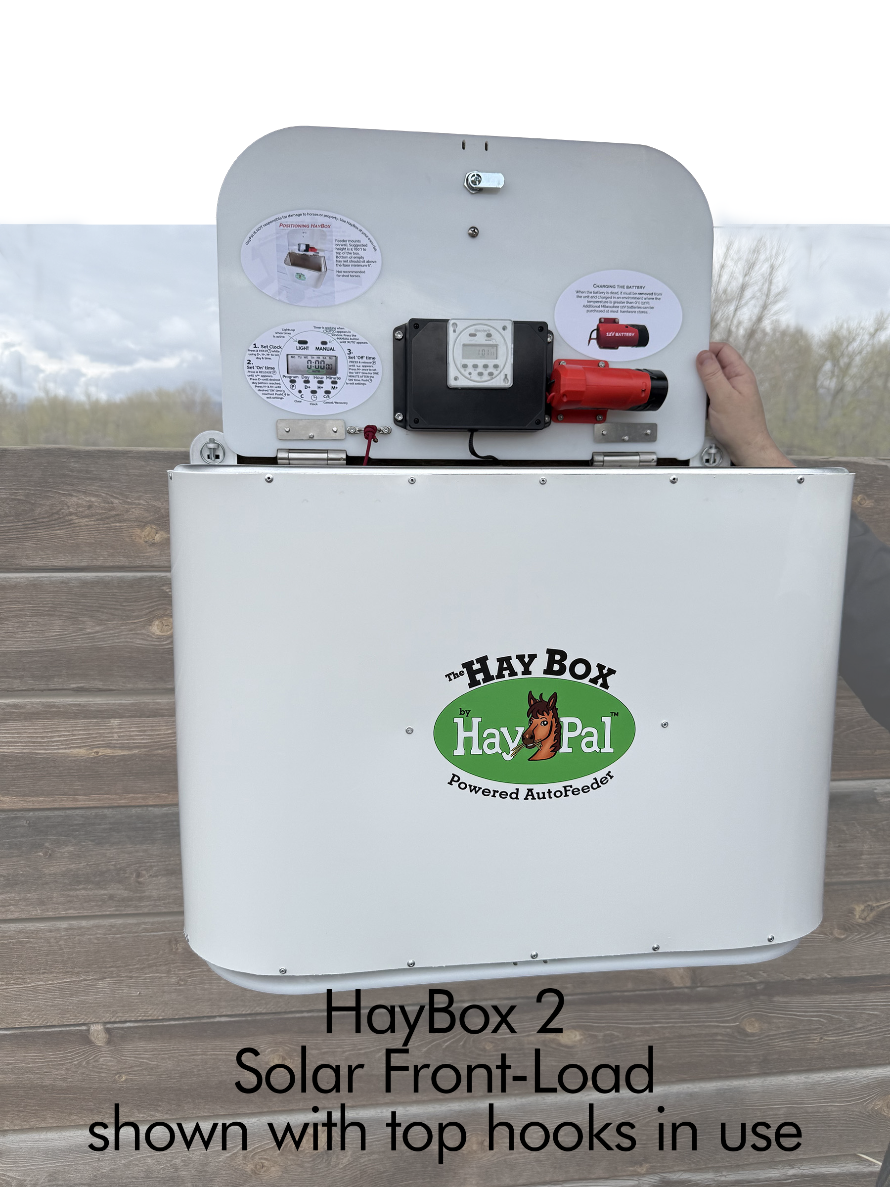 HayBox2-SOLAR-FRONT-load-mounted-to-outside-stall-with-portable-hooks.png
