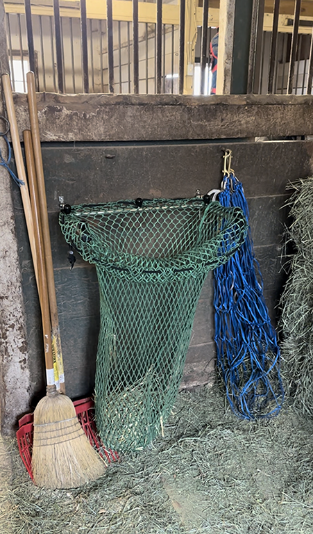 HayPal-mounted-hay-net-filler-in-use.png