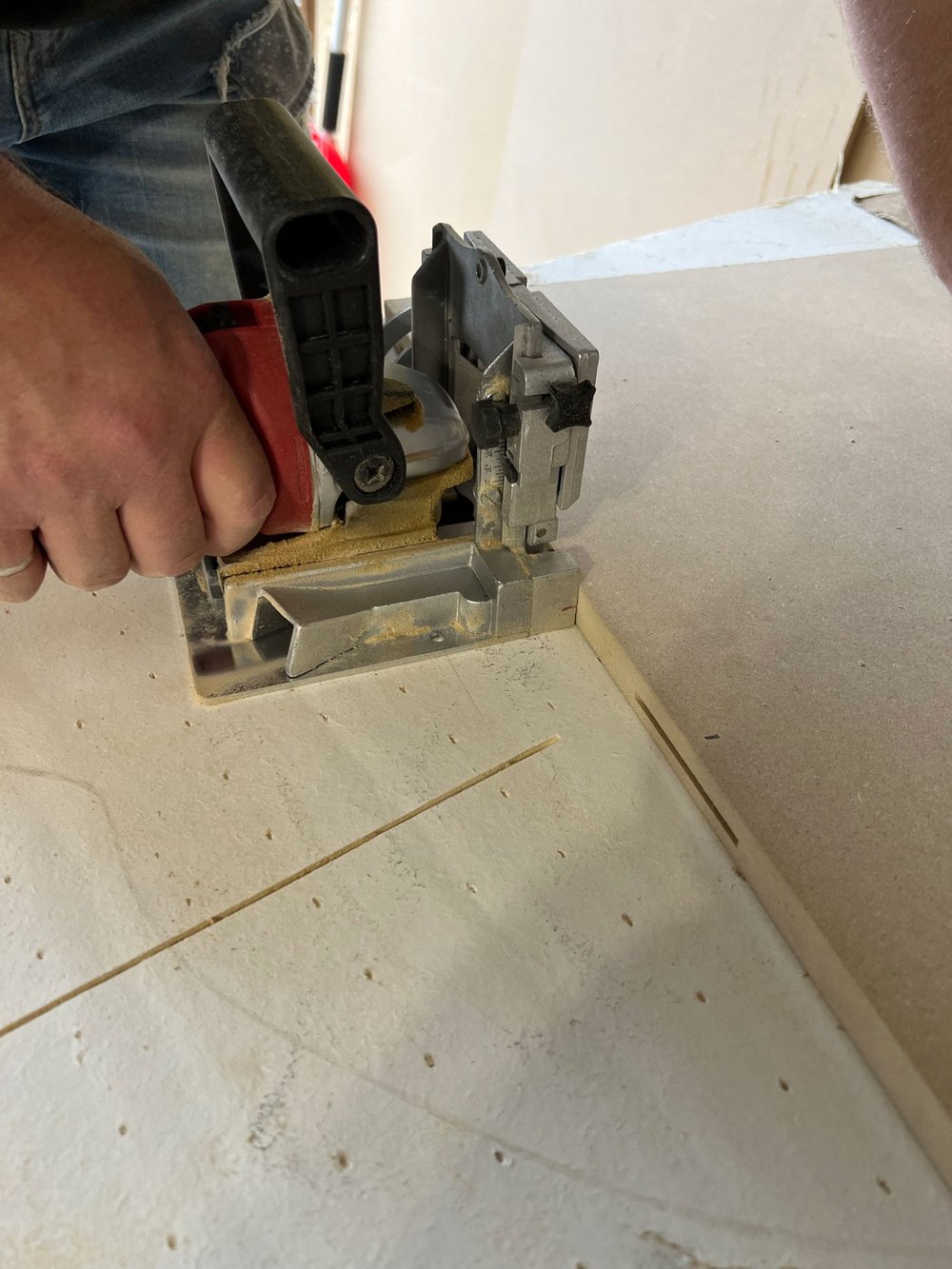 Cutting-buscuit-holes-in-side-of-MDF-closeup.jpg