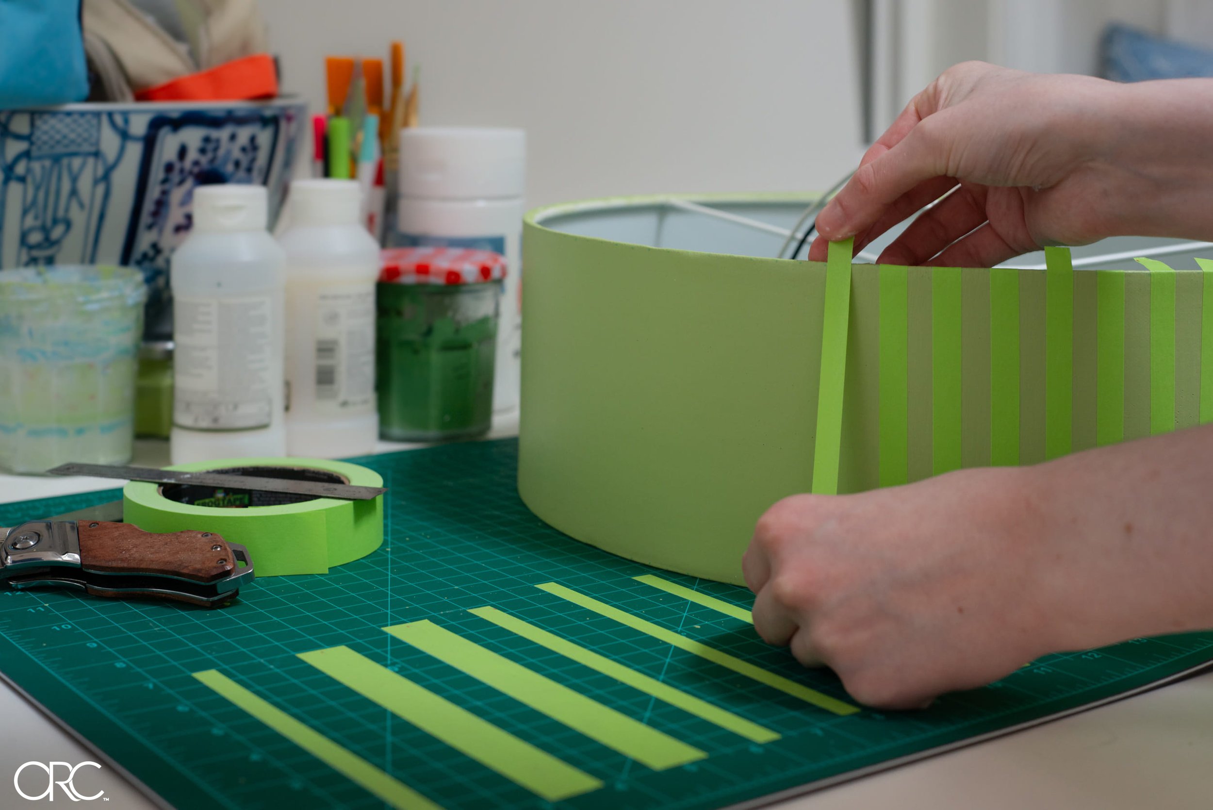 oneroomchallenge-frogtape-light-fixture-placing-tape.jpg