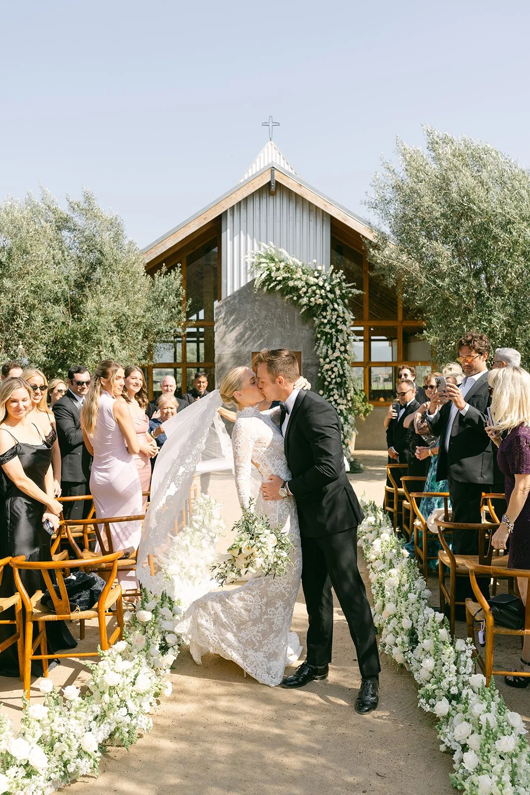 newlyweds_kissing_walking_off_altar_casa_bruma_valle_de_guadalupe.jpg.jpg