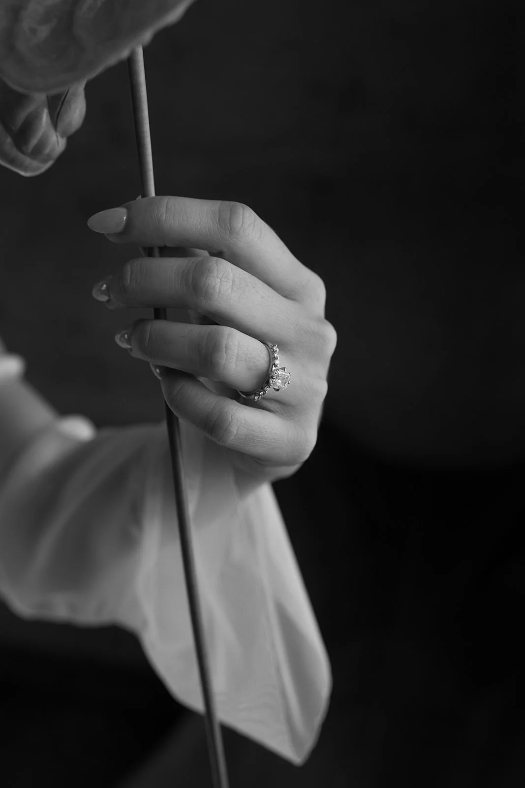 bride_hand_wedding_ring_holding_leaf_black_white.jpg.jpg