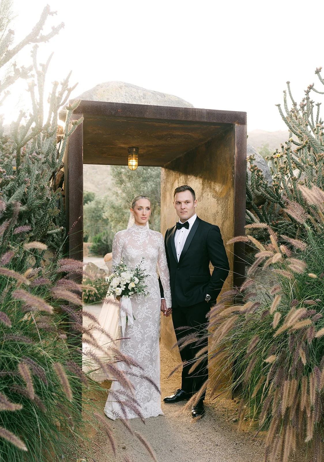 newlyweds_framed_by_plants_construction_casa_bruma_valle_de_guadalupe.jpg.jpg