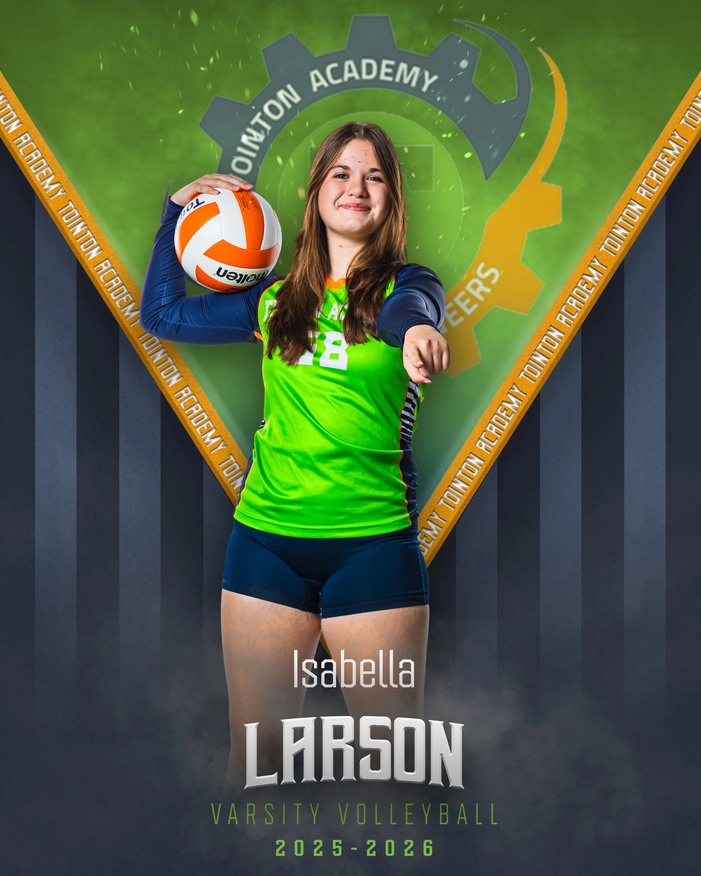 Young female volleyball player posing with a volleyball in front of a green and blue academy logo background, wearing green and blue sports uniform, with her right arm extended forward and left arm holding the volleyball on her shoulder. The text on 