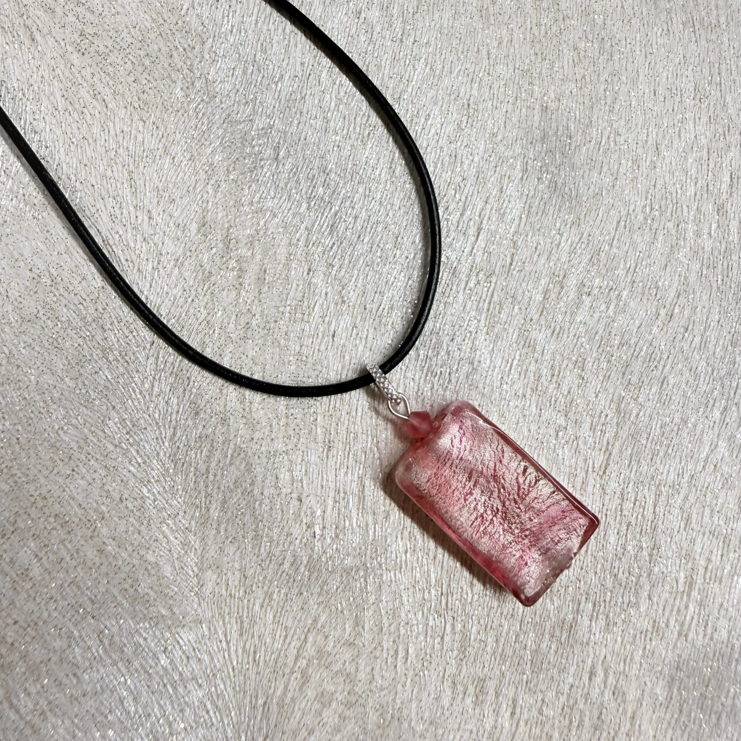 Pink Murano lozenge on black leather cord