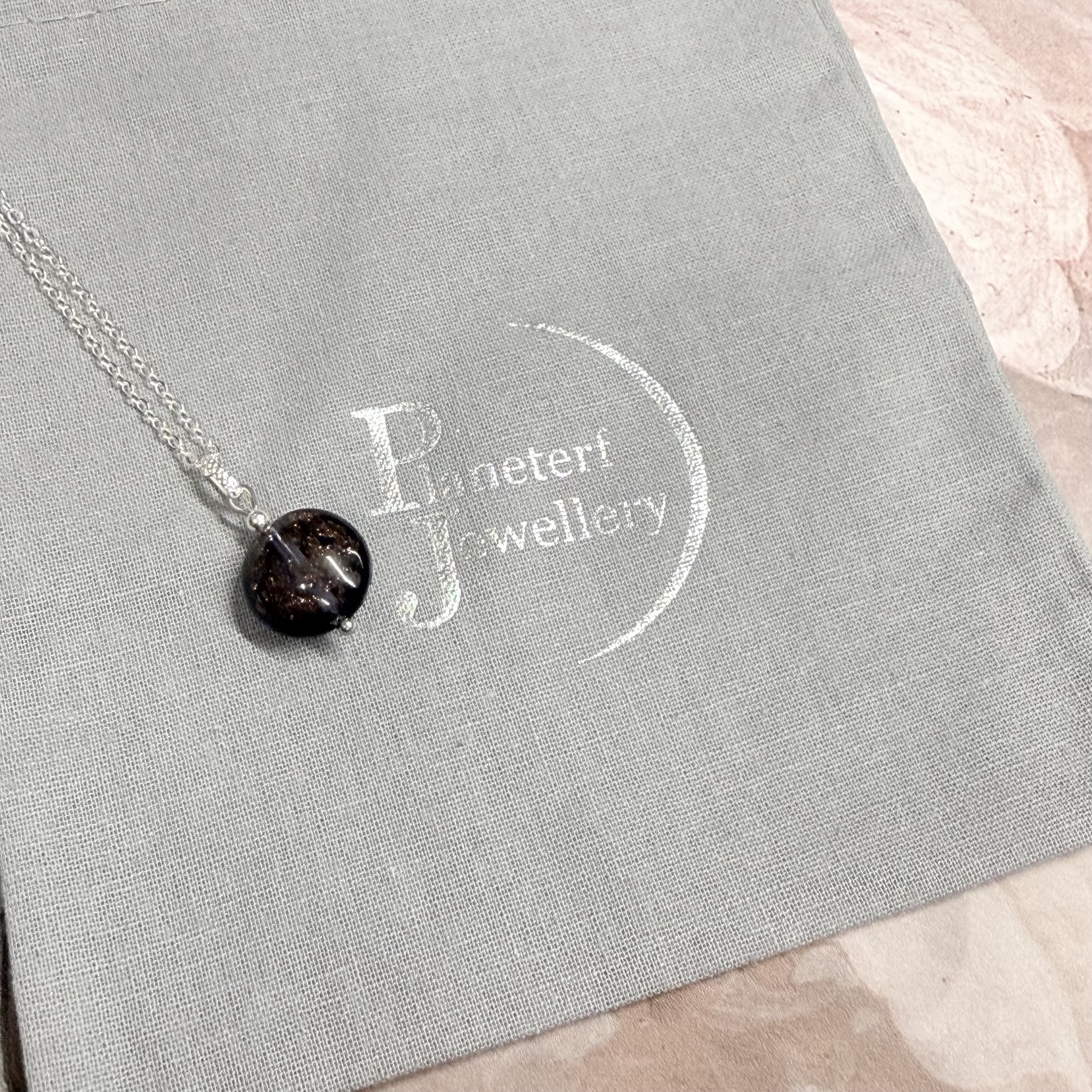 Dark plum speckled Murano round on sterling silver