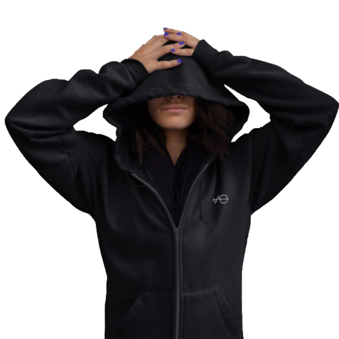 Person wearing a black hoodie with the hood pulled over their eyes, with hands resting on top of the hood, and purple nail polish.