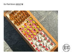 Boxed sushi with various types of sashimi and rolls