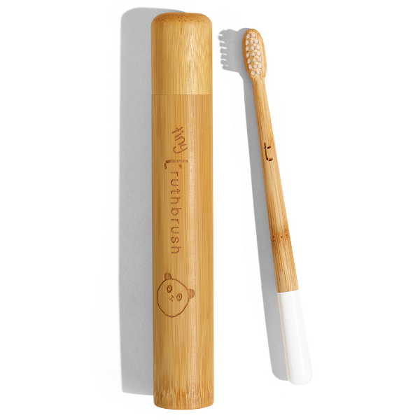 Bamboo toothbrush with a white handle in a bamboo case, with an illustration of a bear's face on the toothbrush handle.