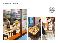 View of a bakery or cafe with people ordering and food displays, including a tray of baked goods and a box of assorted pastries or cakes.