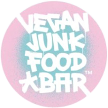 Vegan Junk Food Bar logo on pink circular background