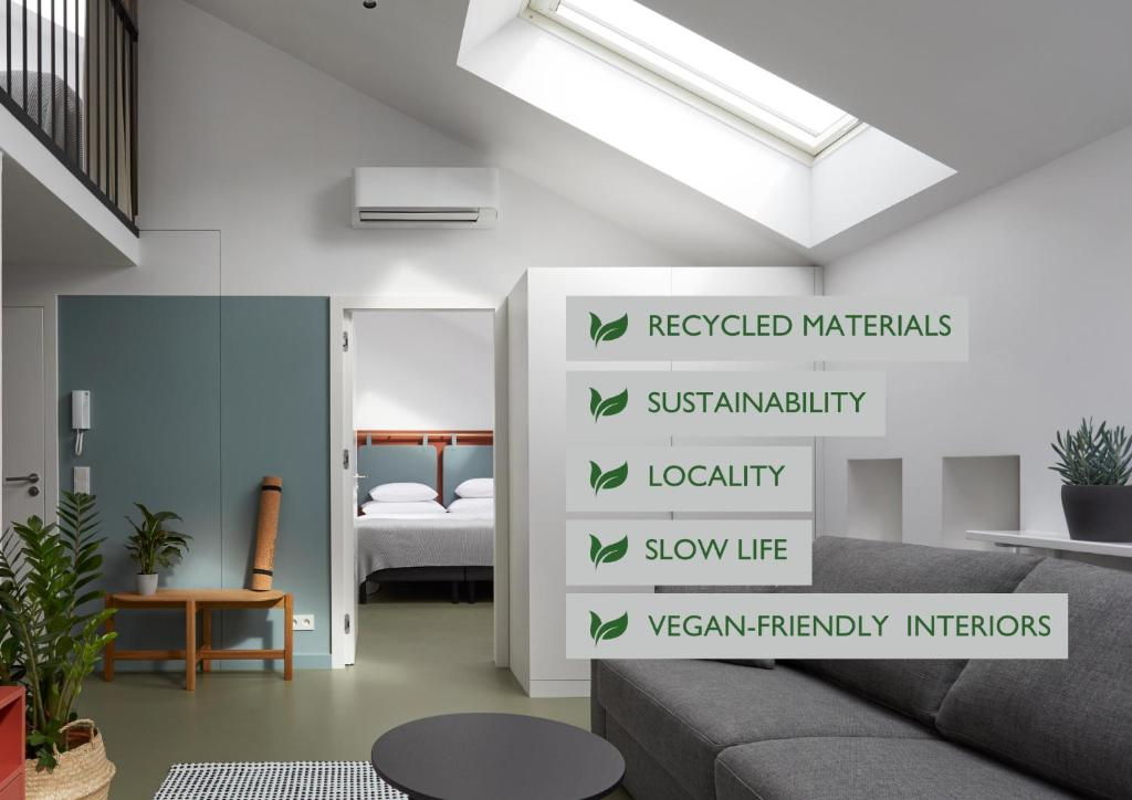 Modern, eco-friendly interior room with sofa, plants, and a skylight, highlighting sustainability and recycled materials.