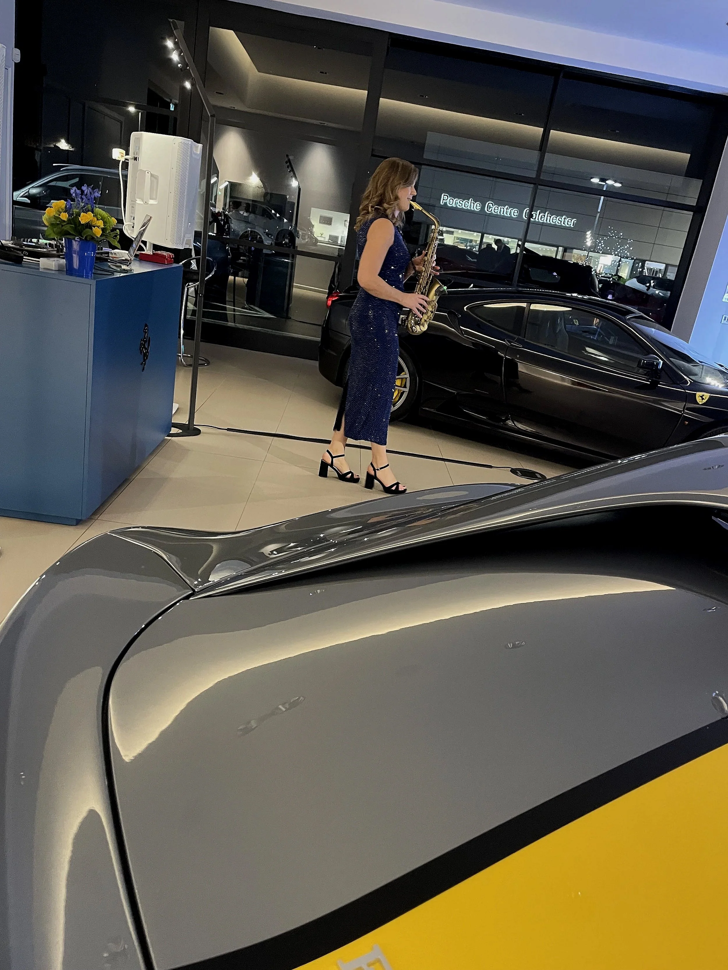 Sax player performs at Ferrari unveiling of Amalfi car in Colchester