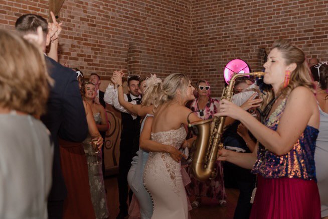 Sax player with DJ during wedding party in Norfolk