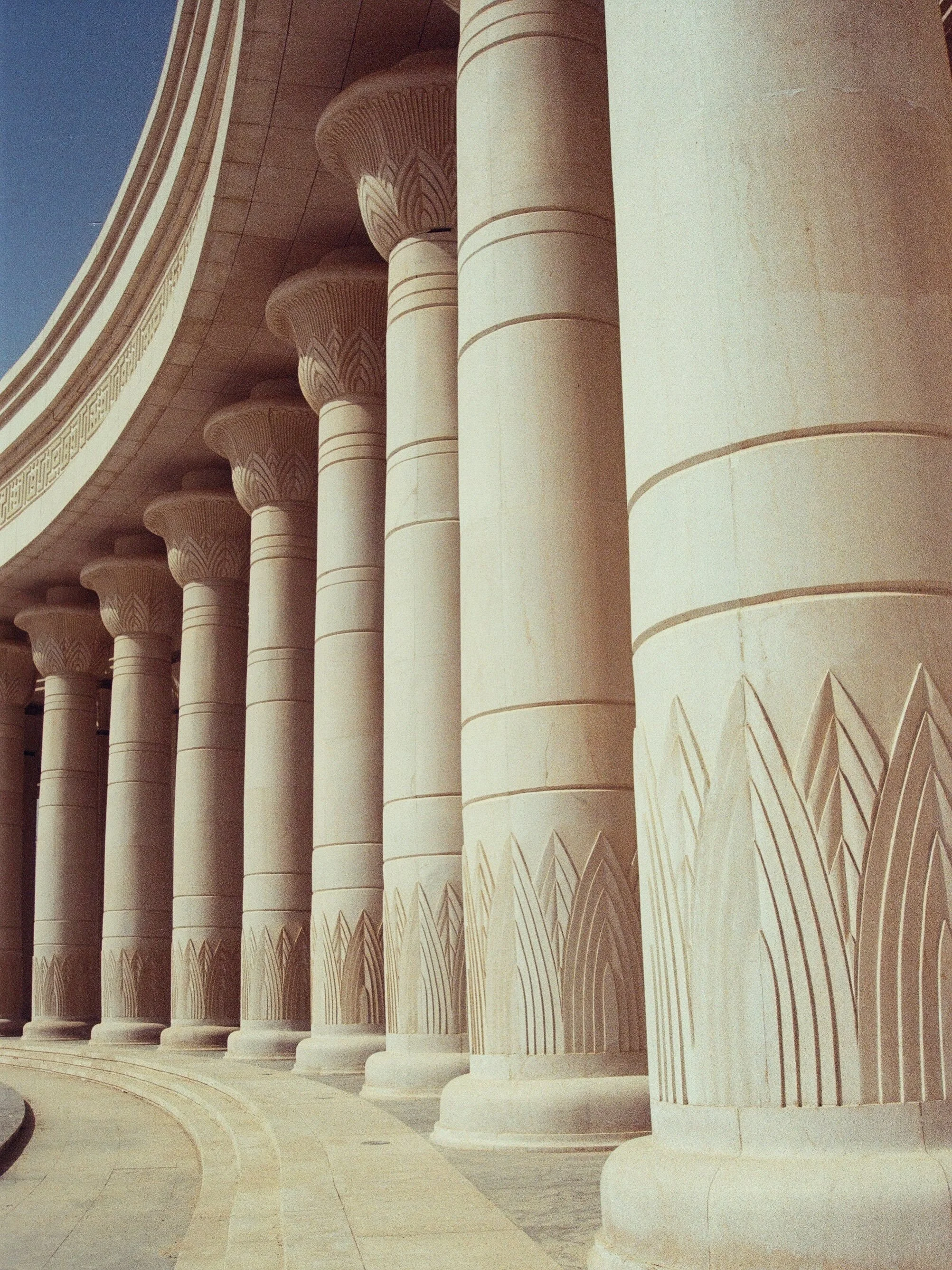 a byzantine-islamic-pharaonic-brutalist fever dream appears in the desert #35mm