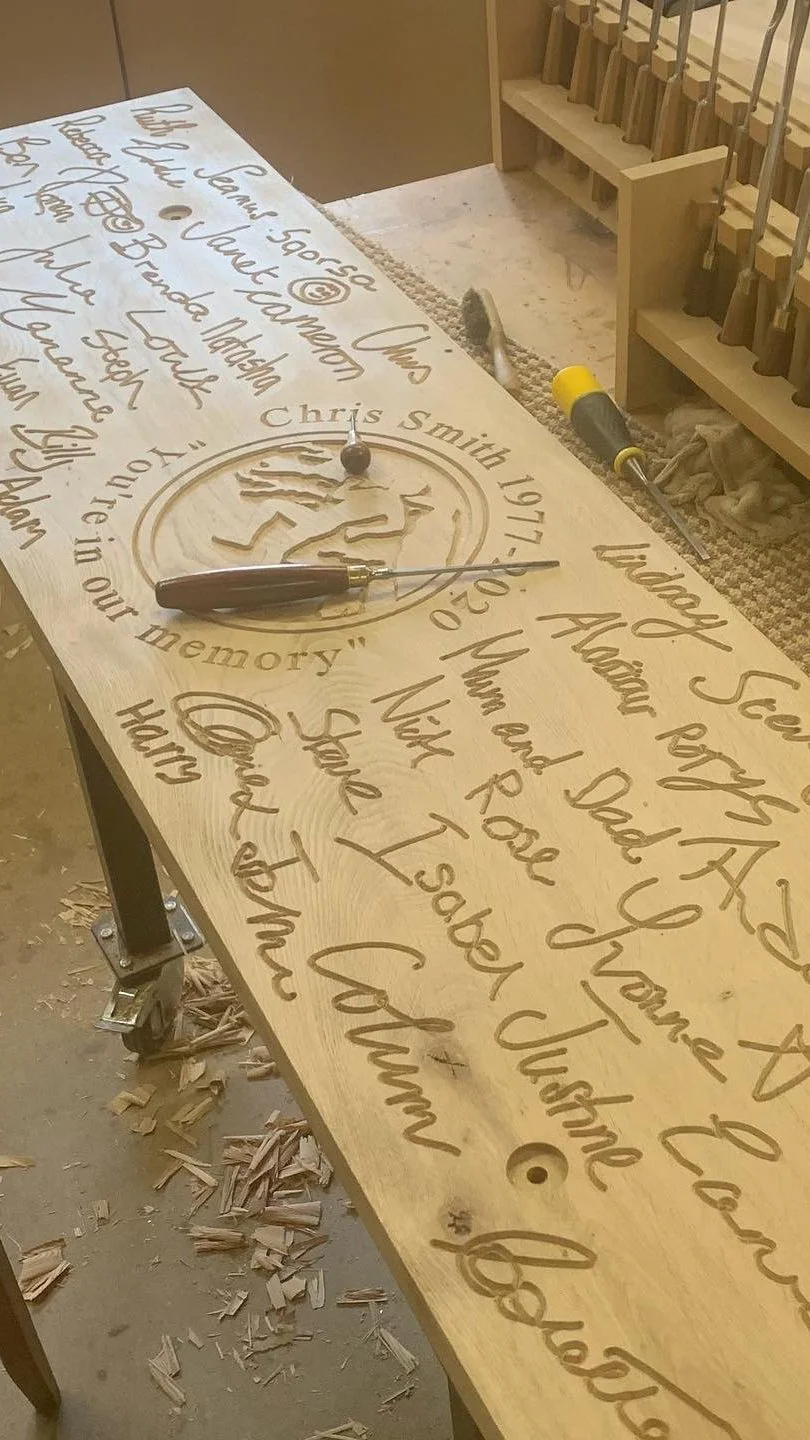 chris smith memorial bench being carved.jpg