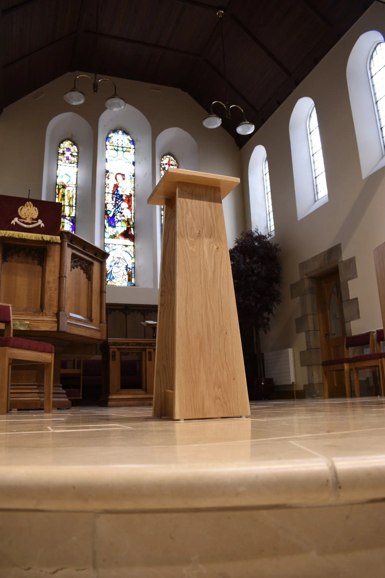 Bespoke Oak Church Stand

A handmade oak church stand designed with clean, simple lines and a quiet architectural form. The natural oak grain and tapered shape allow it to sit comfortably within the traditional church interior, adding warmth without 