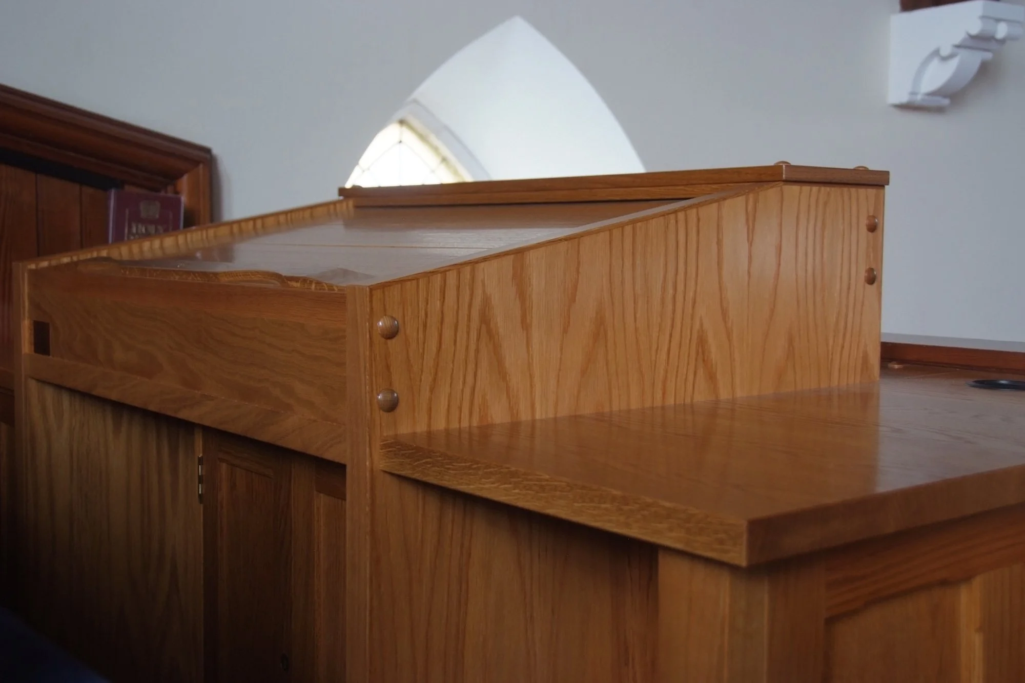 Bespoke Oak Sound Desk

A handmade oak sound desk designed for a church interior, with solid timber construction, detailed edging and a polished finish. The piece is made to house technical equipment while still sitting naturally within the surroundi