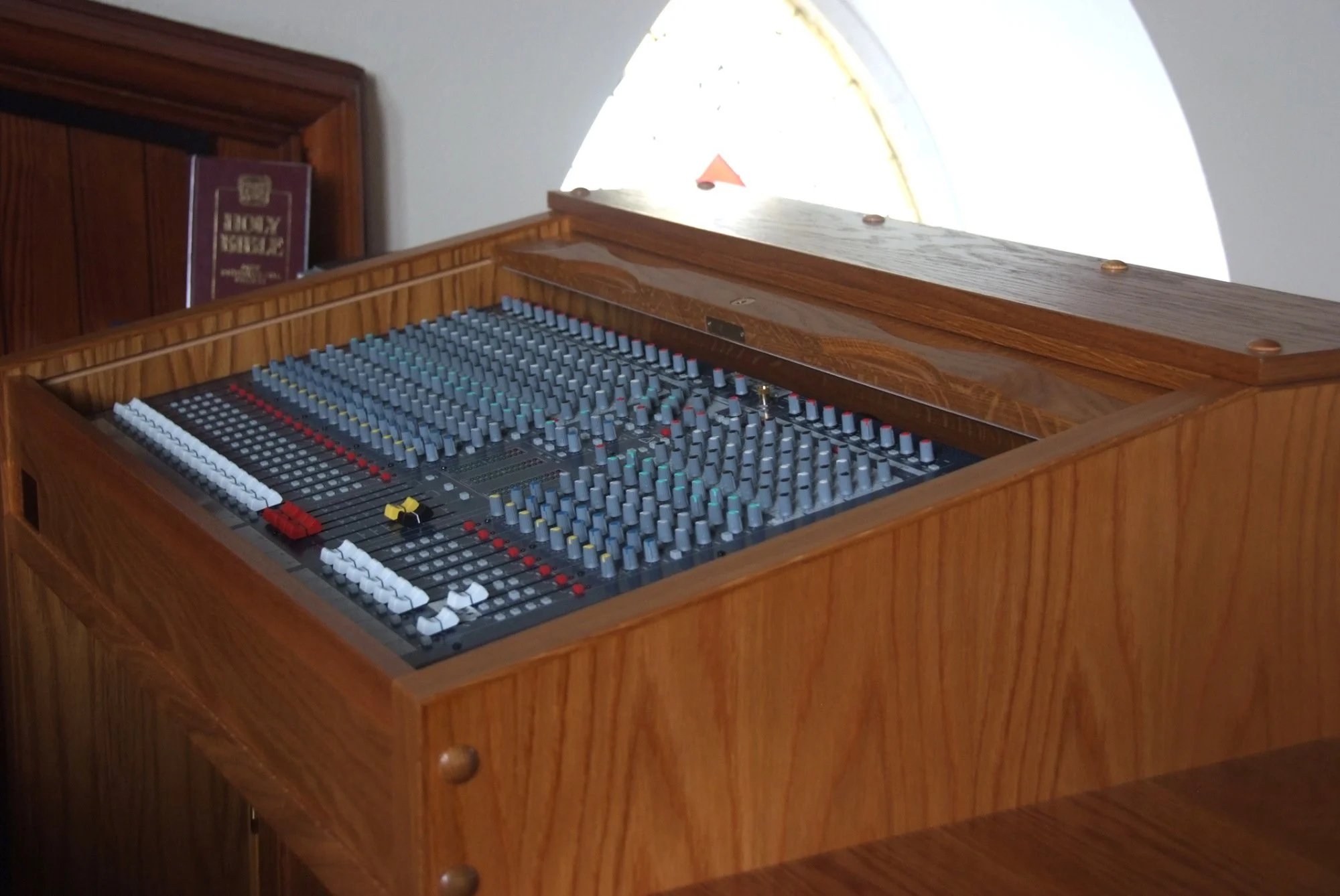 Bespoke Oak Sound Desk Cabinet

A handmade oak sound desk cabinet designed to house audio equipment neatly within a church interior. The solid timber surround, polished finish and carefully fitted details allow the modern sound system to sit comforta